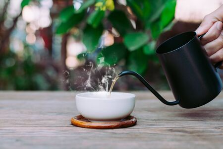 Country hot tea, Pouring tea onto the teacup, Close-upの写真素材