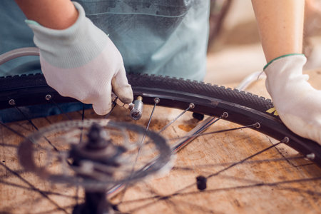 Bicycle Tire Care, Cyclist are fixing bicycle wheels, Close-up.