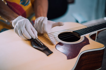 Custom acoustic guitar tuning, Technician is editing the acoustic guitar.