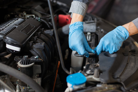 Engine maintenance, Mechanic is checking the car before leaving, Close-up.