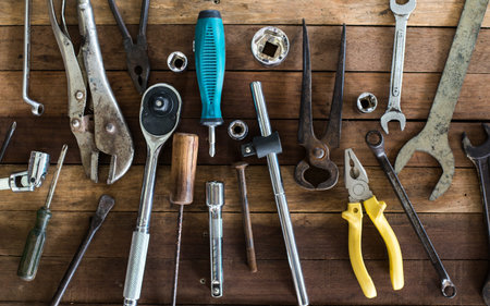 Old tools and new tools, Placed on an old wooden table, Top view.