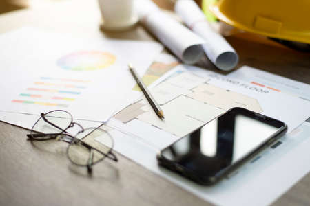 Architect's desk, Analysis of house building designs, Focus on the pencil, Close-up.の写真素材