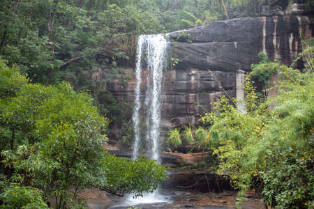 Tropical waterfall, waterfall in the rainy season flows through the mountains.の写真素材