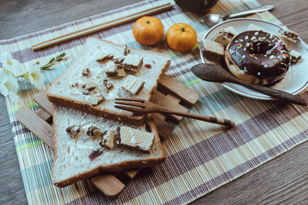 Rustic breakfast, Bread is placed on an artistic table, Soft focus.の写真素材