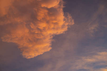 Red clouds in the evening sky were hit by sunlight, Summer sky.の写真素材