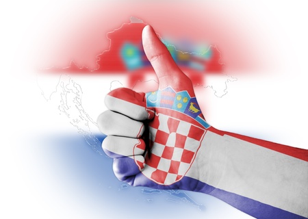 Thumb up with digitally body-painted Croatia flagの写真素材
