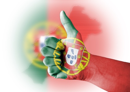 Thumb up with digitally body-painted Portugal flagの写真素材
