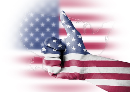 Thumb up with digitally body-painted USA flagの写真素材