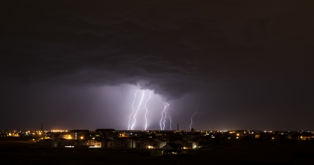 Lightning over small townの写真素材
