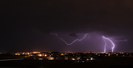 Lightning over small townの写真素材