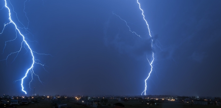 Lightning over small townの写真素材
