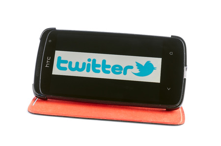 Bucharest, Romania - Jan 24, 2014: Photo of Twitter on smartphone screen. Twitter is an online social networking and microblogging service that enables users to send and read "tweets", which are text messages limited to 140 characters. のeditorial素材