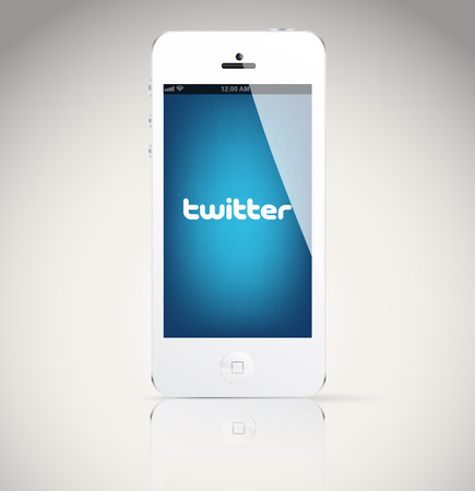 Bucharest, Romania - February 06, 2014: Iphone 5 device, showing the Twitter logo. Twitter is an online social networking and microblogging service that enables users to send and read "tweets"のeditorial素材