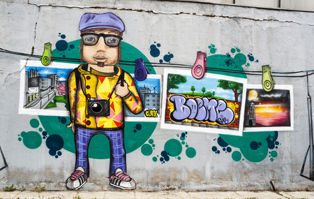 BUCHAREST, ROMANIA -JUNE 1, 2014: Anonymous graffiti image as seen on an alley wall in Bucharest on June 01,2014のeditorial素材