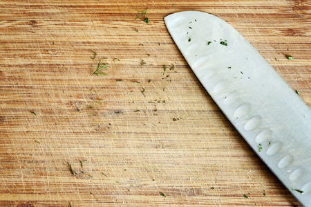 Used knife on rustic kitchen table with copy spaceの写真素材