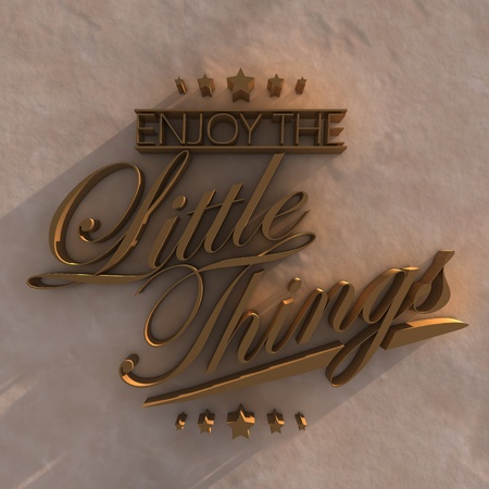 Enjoy the little things. 3D motivational poster.3D gold text on sandの写真素材