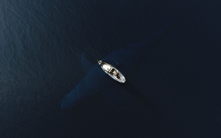 Fish boat floats near big whale in blue ocean. Danger, risk and contrasts concept. 3D Illustrationの写真素材