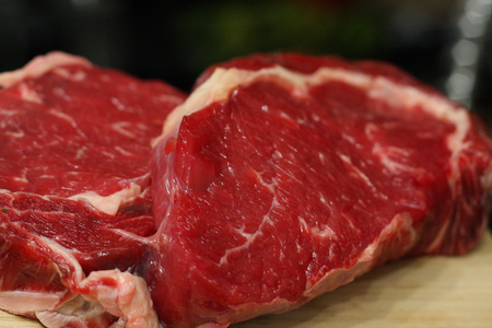 Steaks just ready to be put on a nice fire.の写真素材