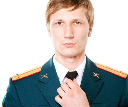 Portrait of a man in military uniform with a tie isolated on white background の写真素材