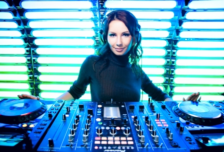 Attractive beautiful girl DJ in the nightclubの写真素材