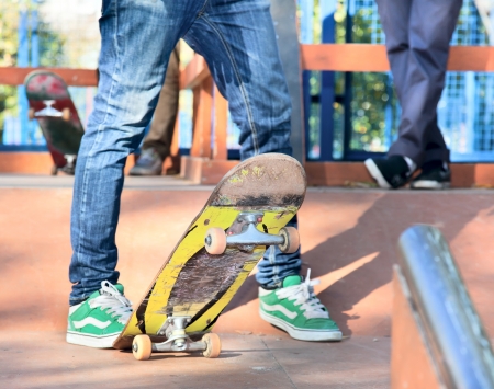Skateboarder legs before jumping on the railingの写真素材