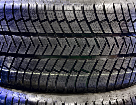 Stack of car tires on warehouse closeup
