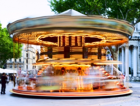 Traditional carousel with running horses for the childrenの写真素材