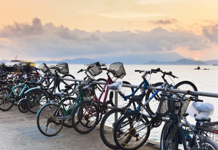 Bikes on the pier at sunset, which left residents of island, when sailing on ferry to mainlandの写真素材