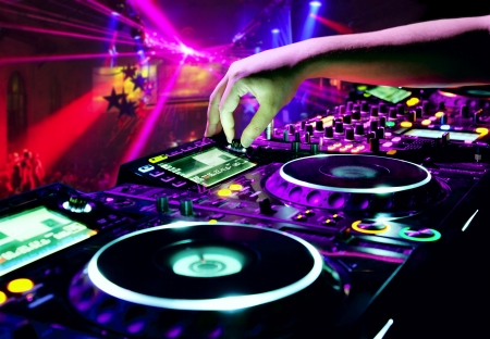 Dj mixes the track in nightclub at partyの写真素材