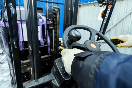 Hands of the driver of forklift in warehouse
の写真素材