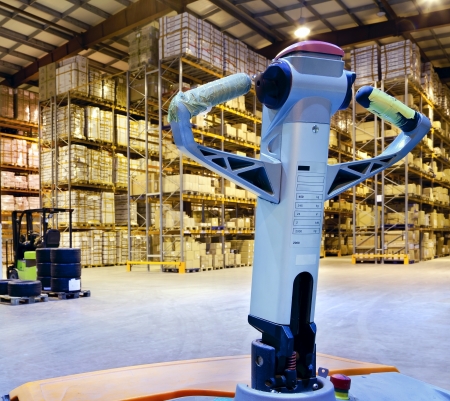 Large modern warehouse with forkliftsのeditorial素材