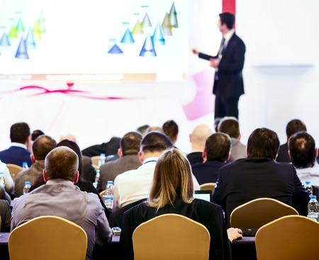 Speaker on the podium  People at the conference hall  Rear viewの写真素材