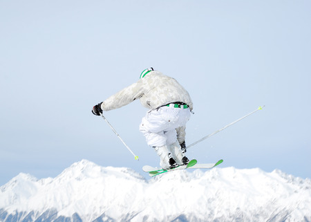 Jumping skier on the sky. Rear viewの写真素材