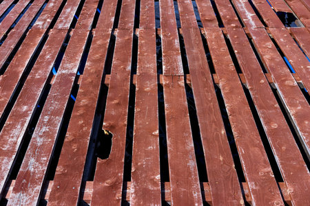 Damaged old wooden platform  Fragment fishing pier on the lake