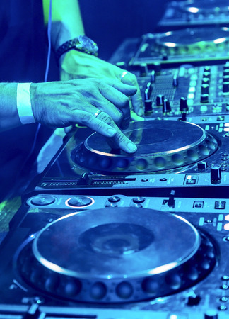Dj mixes the track in the nightclub at partyの写真素材