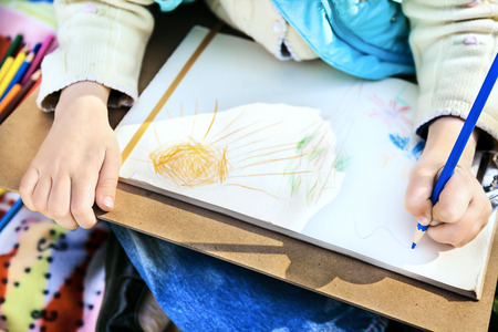 Child's drawing with a colored pencilsの写真素材