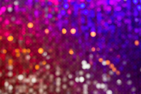 Beautiful abstract bokeh surface multicolored sparkles defocused on the backgroundの写真素材
