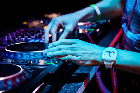 Dj mixes the track in the nightclub at partyの写真素材