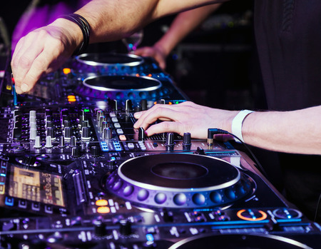 Dj mixes the track in the nightclub at partyの写真素材