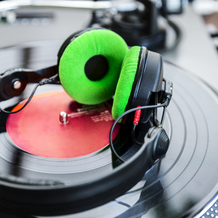 Dj mixer and vinyl player with headphones at clubの写真素材