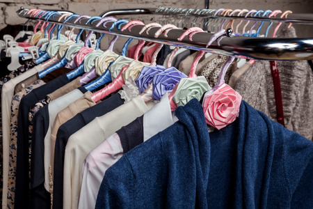 Collection fashion clothing on hangers at the showroom closeupの写真素材