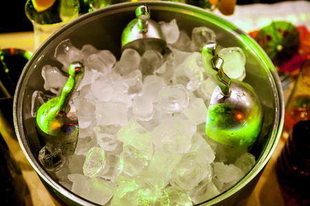 Ice for cooling drinks and cocktails in a large cup at the barの写真素材
