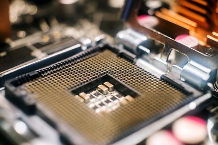 Computer central processor empty socket closeup on motherboard with shallow depth of fieldの写真素材