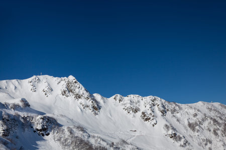 Beautiful landscape of Caucasus Mountains on Krasnaya Polyana on background clear sky