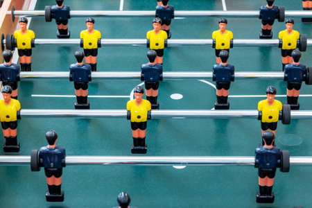 Classic foosball, a fragment of the centre playing field with rows of player figures close-up