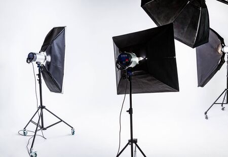 Large photostudio with lighting equipment on background of white cycloramaの写真素材