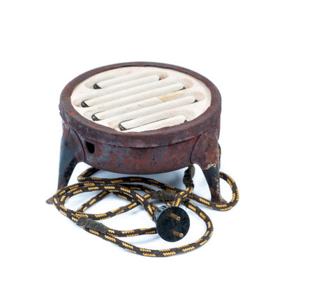 Old rusty electric stove with damaged network cable for EU outlet closeup isolated on white background. Made in USSRの写真素材