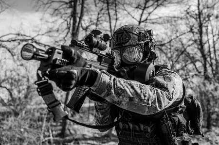 Armed soldier in Cropat pattern uniform wearing M95 Gas mask and assault rifle HK G36.の写真素材