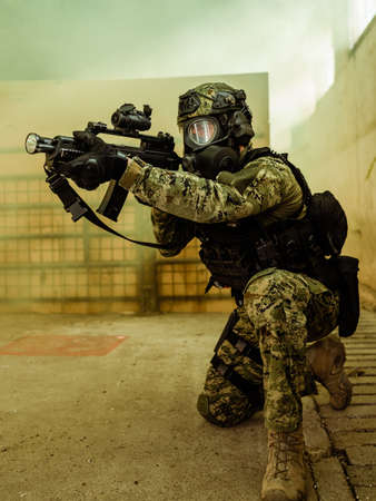 Armed soldier in Cropat pattern uniform wearing M95 Gas mask and assault rifle HK G36.の写真素材
