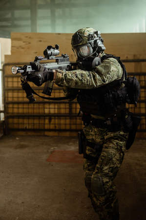 Armed soldier in Cropat pattern uniform wearing M95 Gas mask and assault rifle HK G36.の写真素材